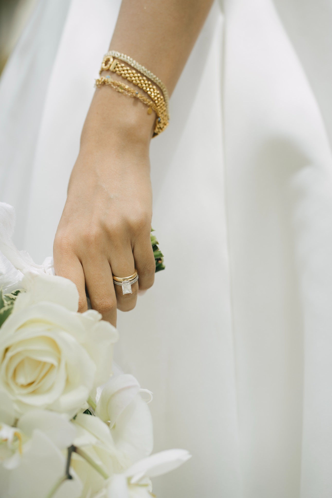 Delicate bridal jewelry and white flowers