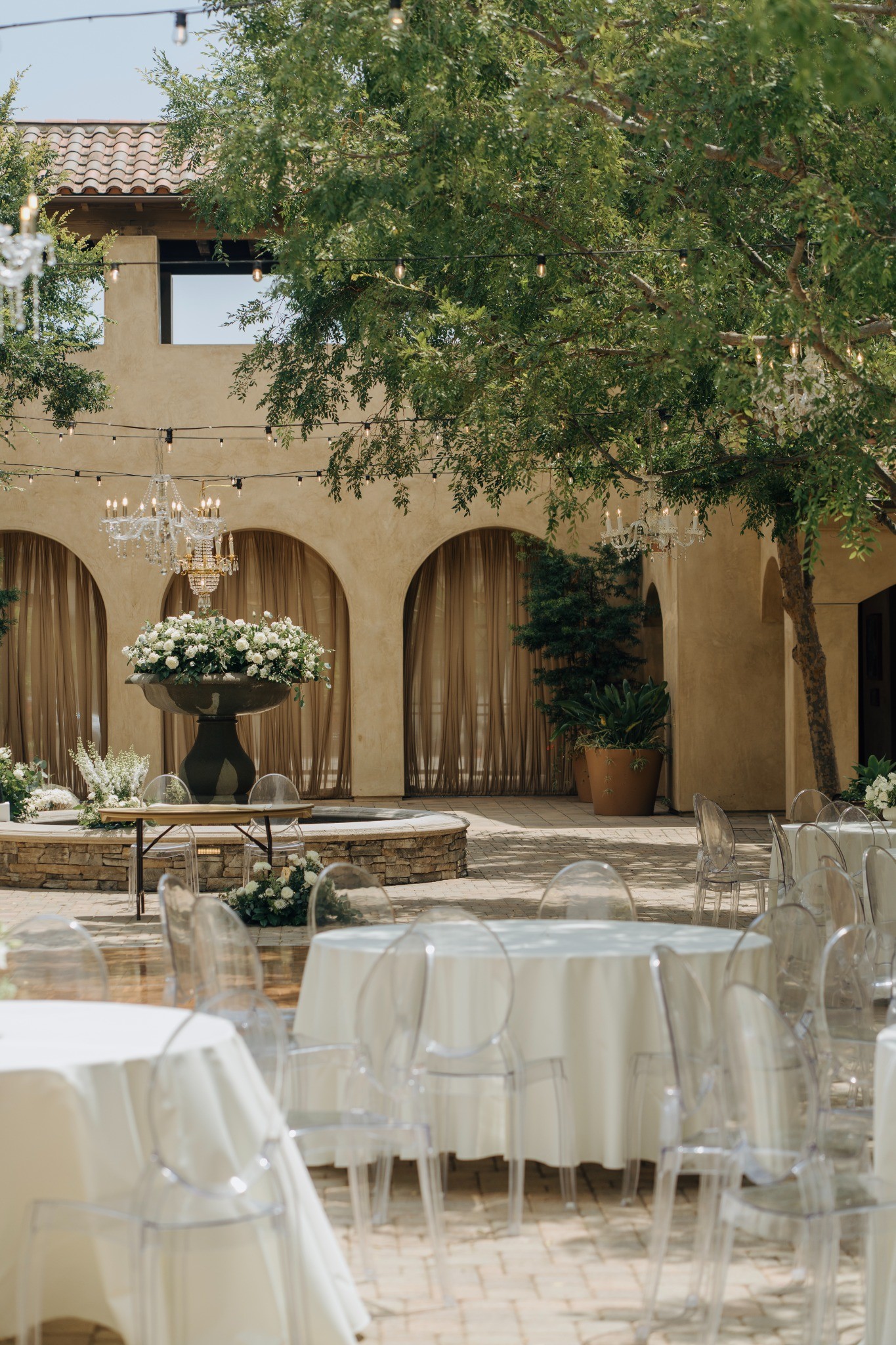 A warm Mediterranean courtyard prepared for a wedding